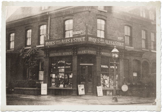 B&W photograph of a corner shop c.1940s